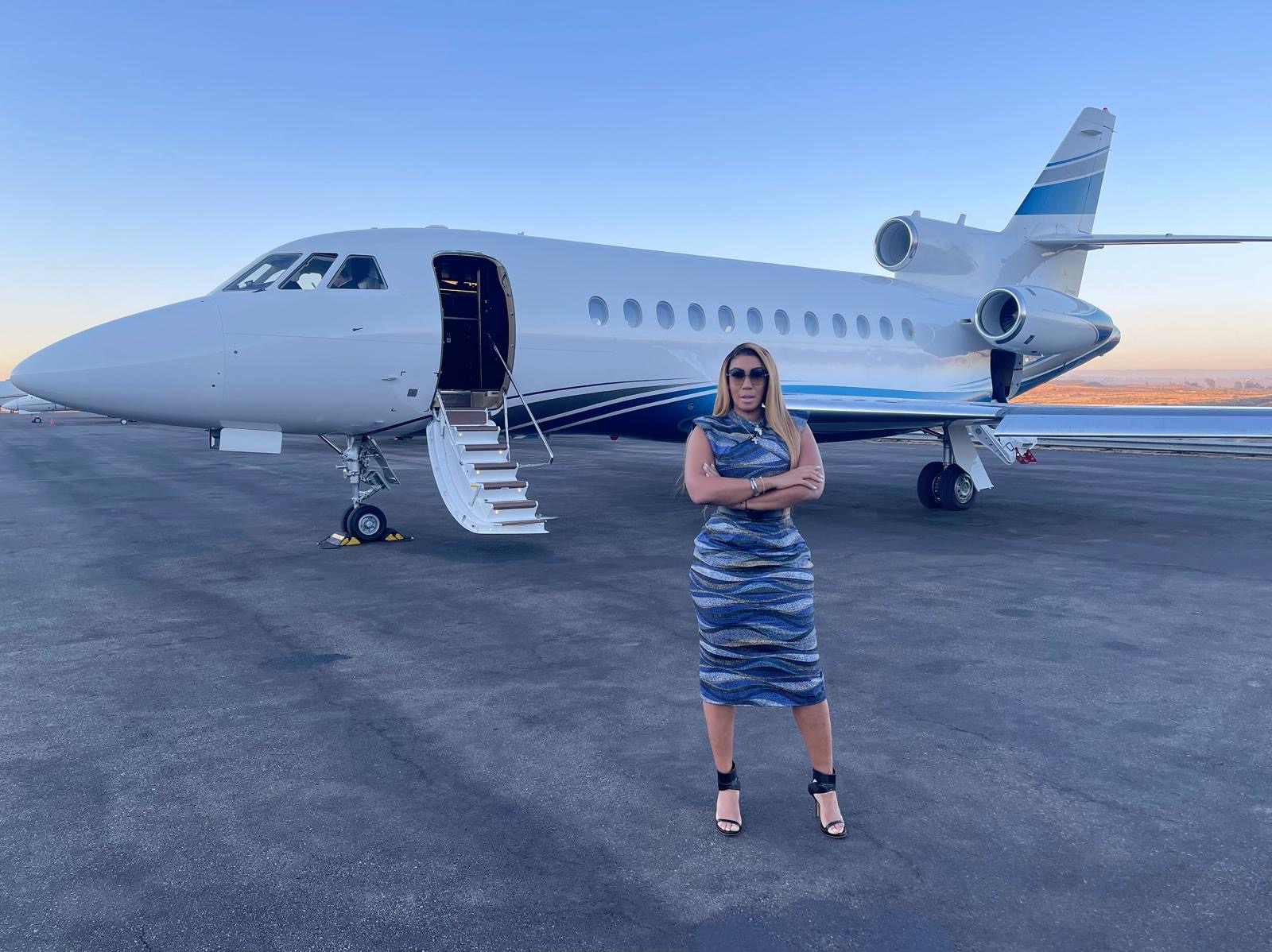 Rockstar Global Investments founder standing beside a private jet at sunset